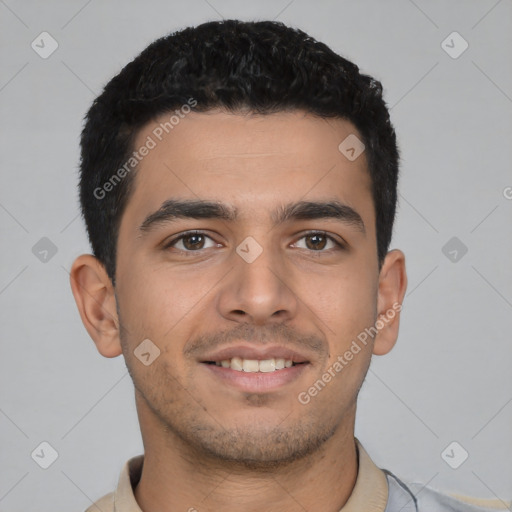 Joyful latino young-adult male with short  black hair and brown eyes