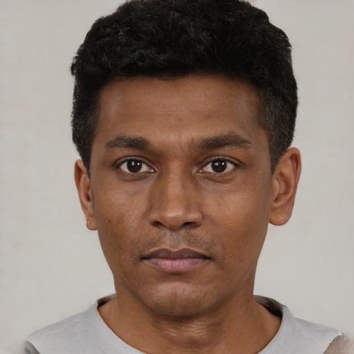 Neutral black young-adult male with short  black hair and brown eyes
