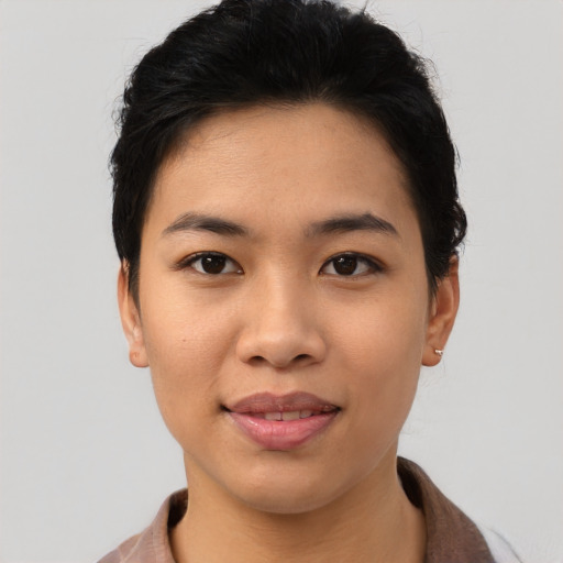 Joyful asian young-adult female with short  black hair and brown eyes