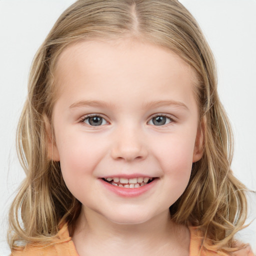 Joyful white child female with medium  brown hair and brown eyes