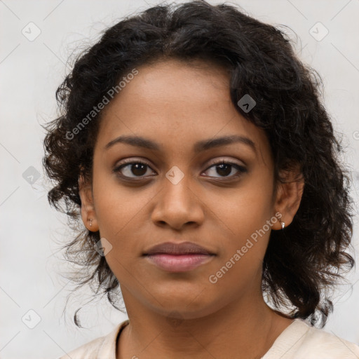 Joyful black young-adult female with long  brown hair and brown eyes