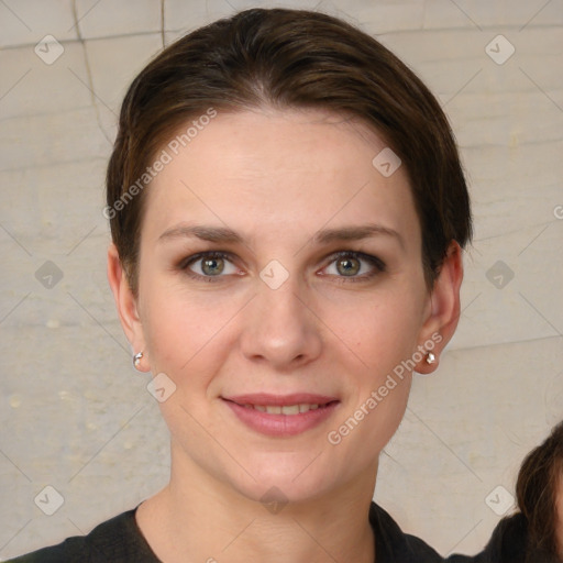 Joyful white young-adult female with short  brown hair and grey eyes