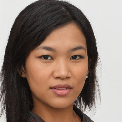 Joyful asian young-adult female with long  brown hair and brown eyes