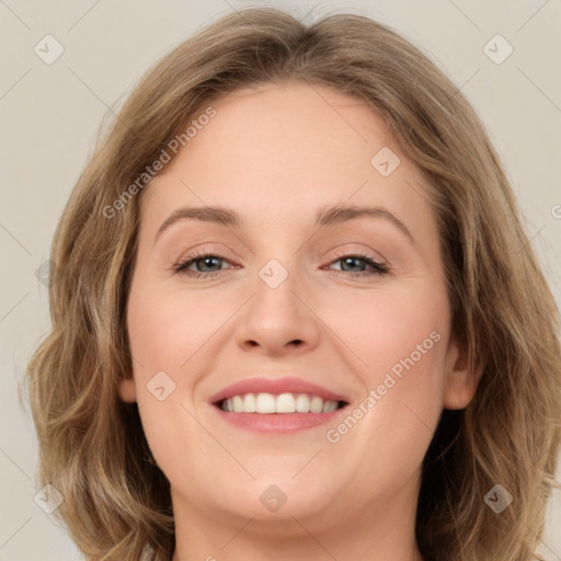 Joyful white young-adult female with medium  brown hair and green eyes