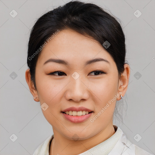 Joyful asian young-adult female with short  brown hair and brown eyes