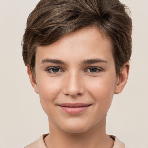 Joyful white child male with short  brown hair and brown eyes