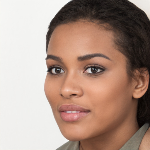 Joyful latino young-adult female with long  brown hair and brown eyes