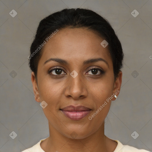 Joyful black young-adult female with short  brown hair and brown eyes