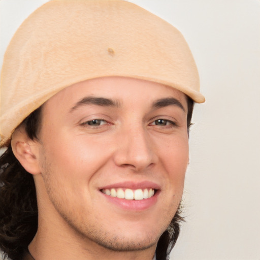 Joyful white young-adult male with medium  brown hair and brown eyes