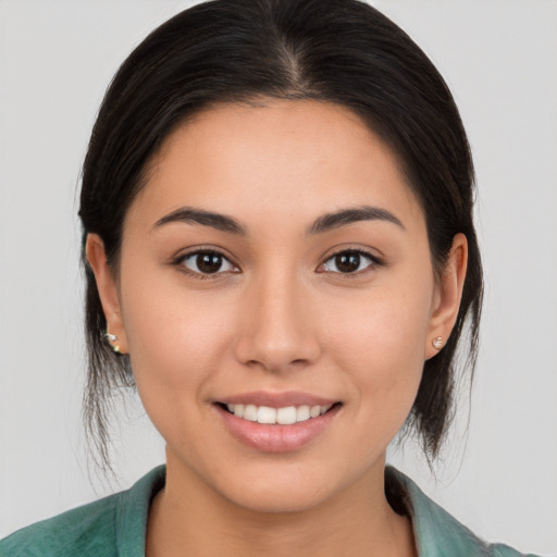 Joyful white young-adult female with medium  brown hair and brown eyes