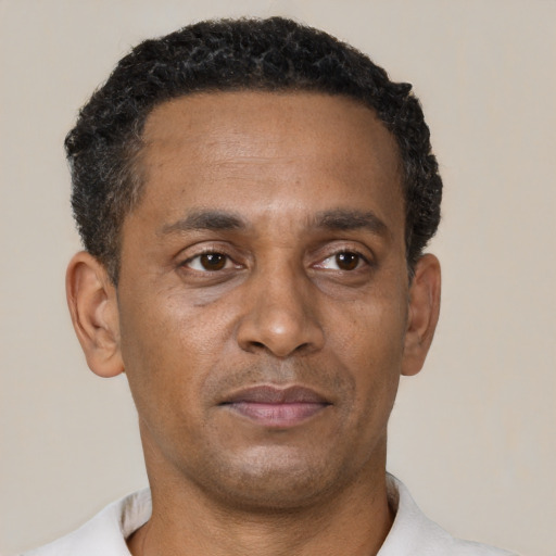 Neutral black adult male with short  black hair and brown eyes
