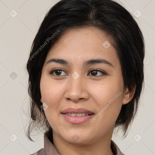 Joyful latino young-adult female with medium  brown hair and brown eyes