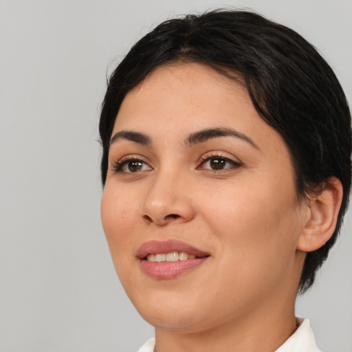 Joyful white young-adult female with medium  black hair and brown eyes