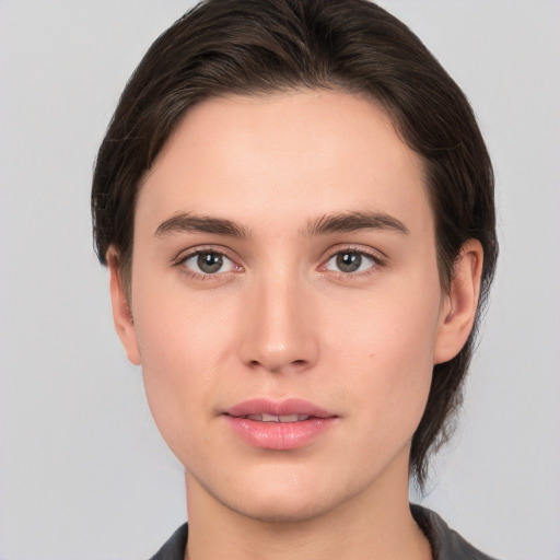 Neutral white young-adult female with medium  brown hair and brown eyes