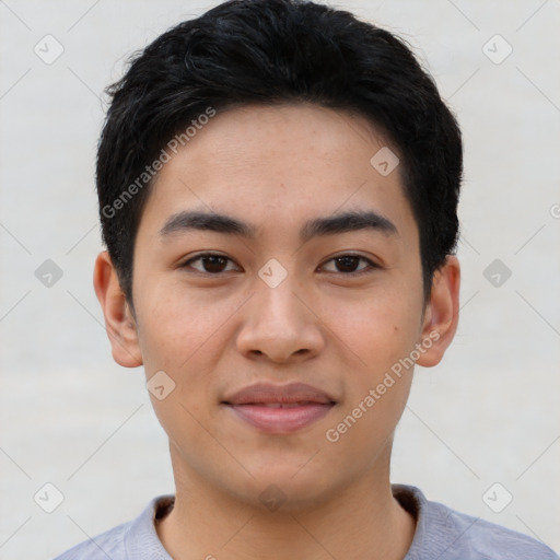 Joyful asian young-adult male with short  black hair and brown eyes