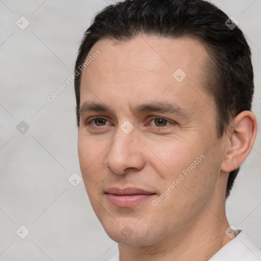 Joyful white adult male with short  brown hair and brown eyes