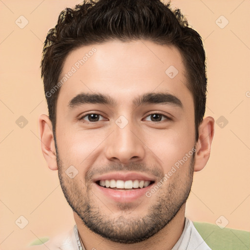 Joyful white young-adult male with short  black hair and brown eyes