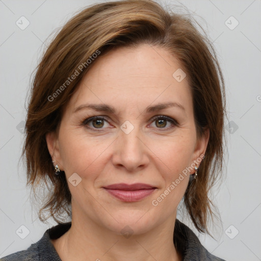 Joyful white adult female with medium  brown hair and grey eyes