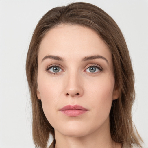 Neutral white young-adult female with long  brown hair and grey eyes