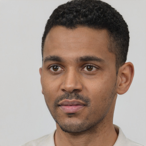 Neutral black young-adult male with short  black hair and brown eyes