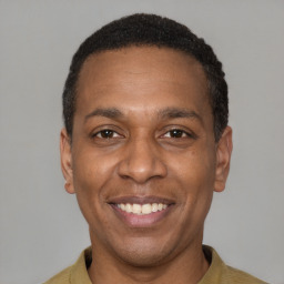 Joyful latino adult male with short  black hair and brown eyes