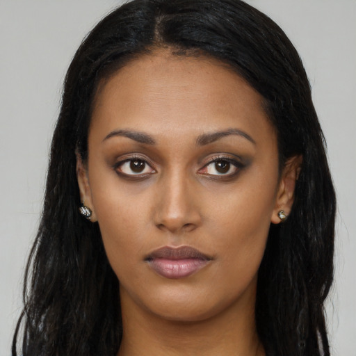 Neutral latino young-adult female with long  black hair and brown eyes