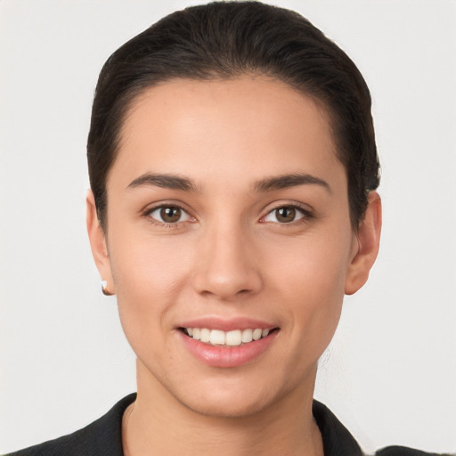 Joyful white young-adult female with short  brown hair and brown eyes