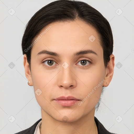 Neutral white young-adult female with short  brown hair and brown eyes