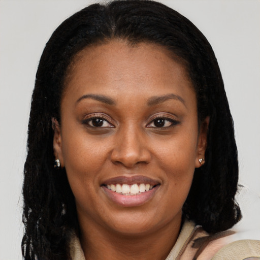 Joyful latino young-adult female with long  brown hair and brown eyes