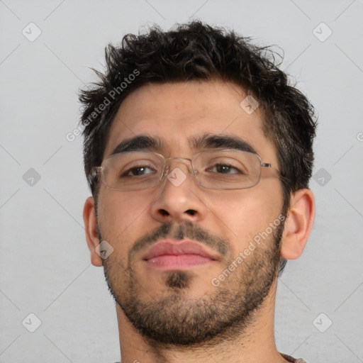 Neutral white young-adult male with short  brown hair and brown eyes