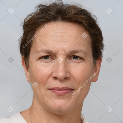 Joyful white middle-aged female with short  brown hair and grey eyes