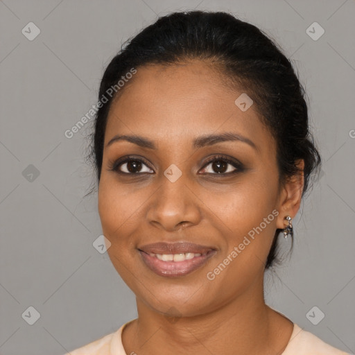 Joyful black young-adult female with medium  black hair and brown eyes