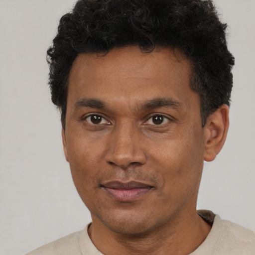 Neutral black adult male with short  brown hair and brown eyes