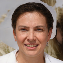 Joyful white adult female with short  brown hair and brown eyes