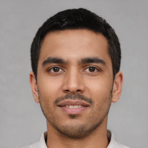 Neutral latino young-adult male with short  black hair and brown eyes