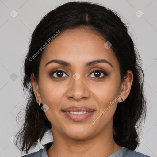 Joyful latino young-adult female with medium  brown hair and brown eyes