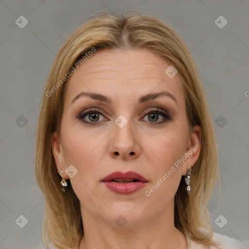 Joyful white adult female with medium  brown hair and green eyes