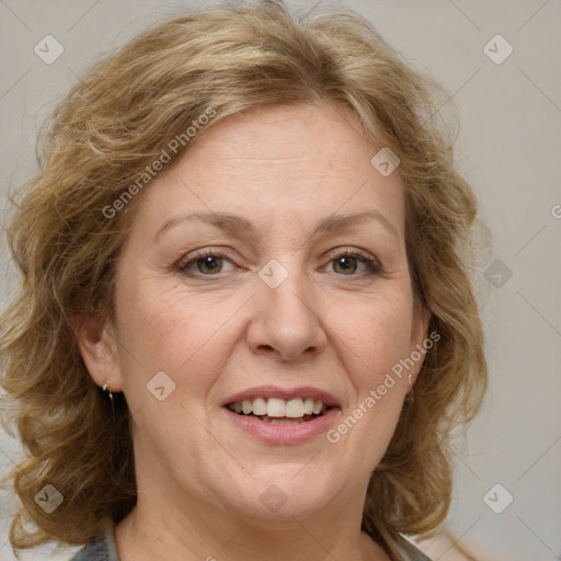 Joyful white adult female with medium  brown hair and blue eyes