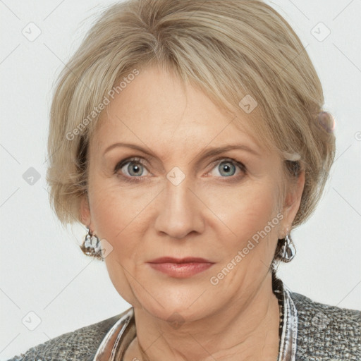 Joyful white adult female with medium  brown hair and blue eyes