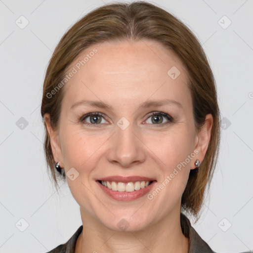 Joyful white young-adult female with medium  brown hair and grey eyes