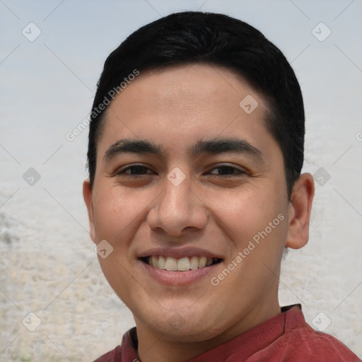 Joyful white young-adult male with short  black hair and brown eyes