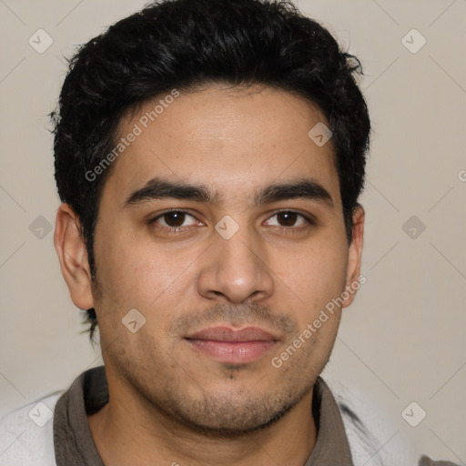 Joyful white young-adult male with short  black hair and brown eyes