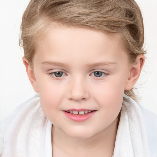 Joyful white child female with long  brown hair and blue eyes