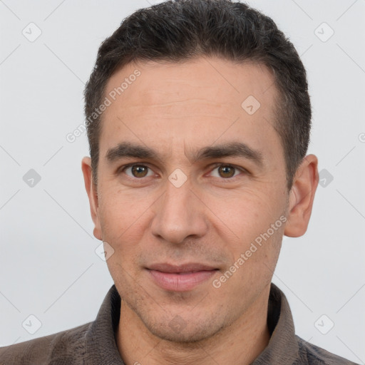 Joyful white adult male with short  brown hair and brown eyes