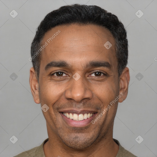 Joyful latino adult male with short  black hair and brown eyes
