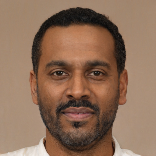 Neutral latino adult male with short  black hair and brown eyes