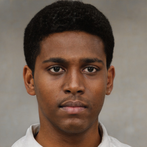 Neutral black young-adult male with short  brown hair and brown eyes