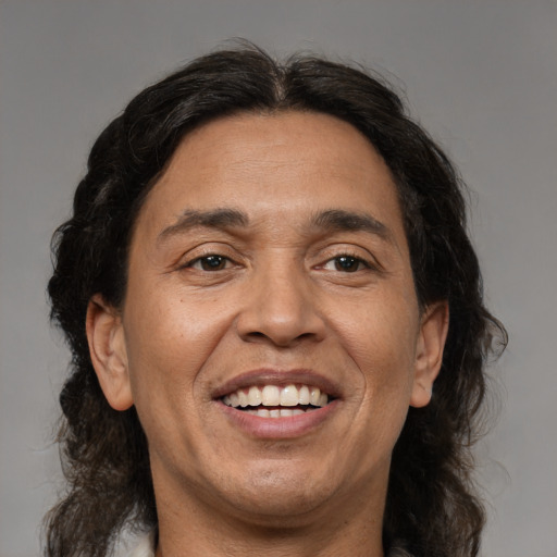 Joyful white adult male with medium  brown hair and brown eyes