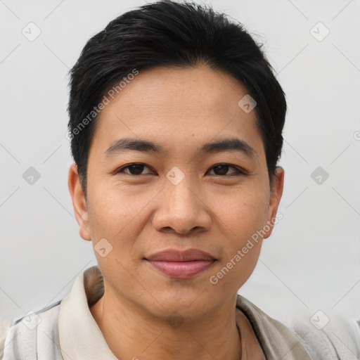 Joyful asian young-adult male with short  black hair and brown eyes