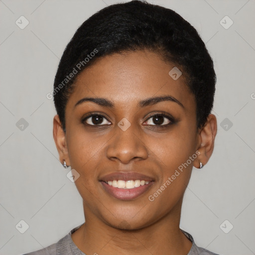 Joyful black young-adult female with short  black hair and brown eyes